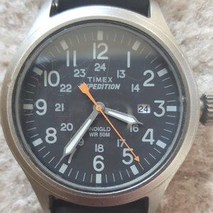 Timex watch with Indiglo in good condition; black leather hand in decent shape